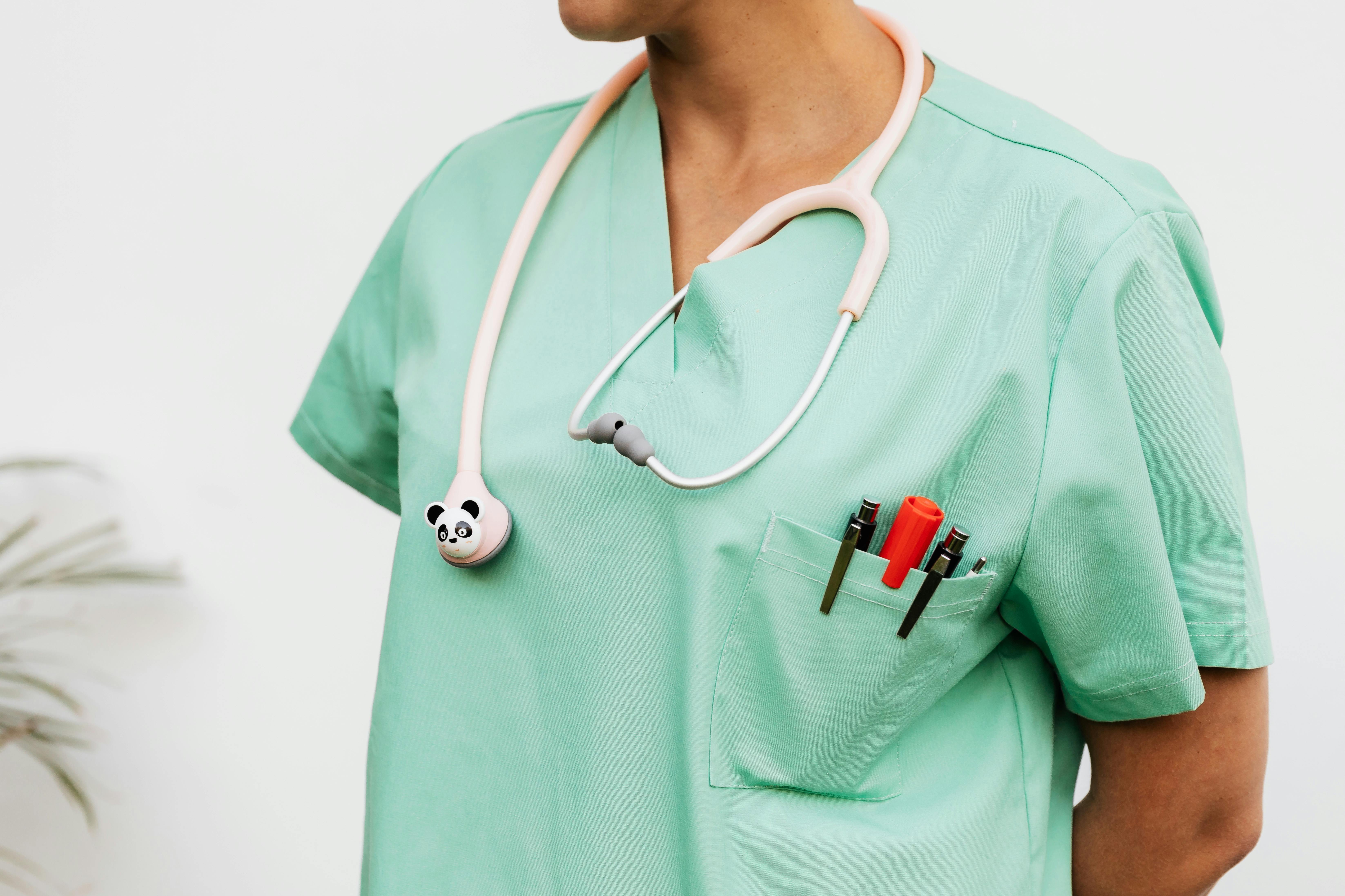 Healthcare professional in scrubs with stethoscope